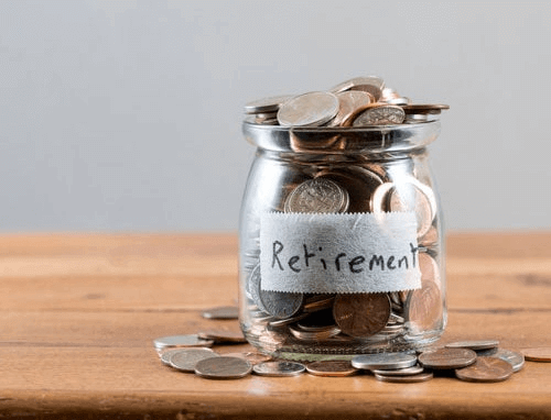 a jar full of coins with the label "retirement" on it